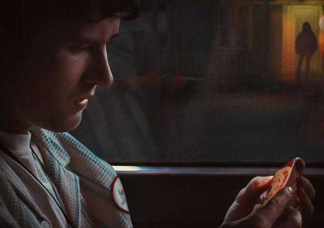 man in car staring at phone with shadowed figure in doorway in background
