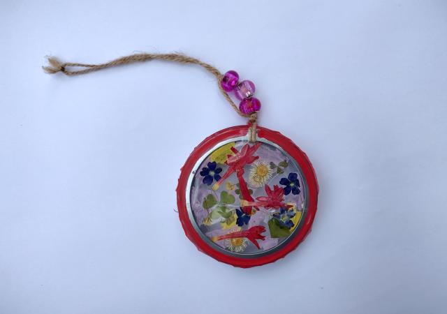 Photo of a pressed flower ornament.