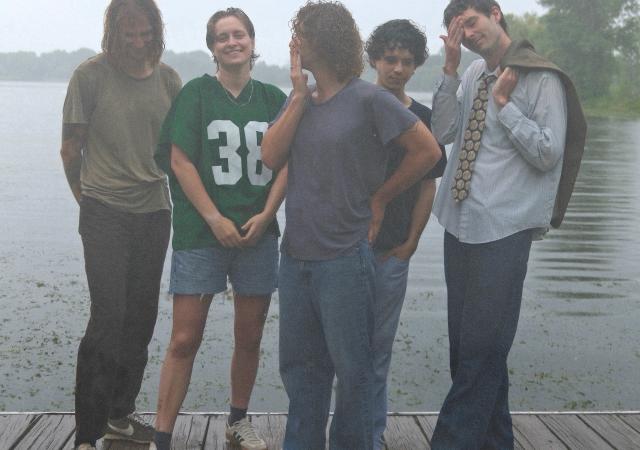 Members of Harlow standing on a dock
