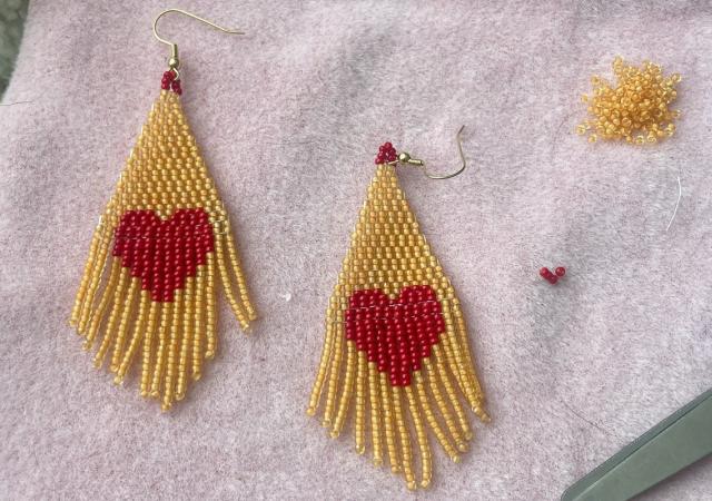 Beaded fringe earrings with heart pattern, made at Wheelhouse Studios