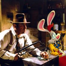 Still from Who Framed Roger Rabbit? Detective holding saw is handcuffed to cartoon rabbit.