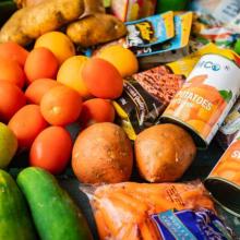 produce and canned goods on a table surface