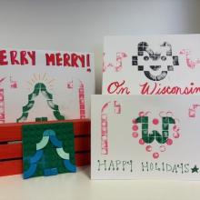 Three samples of Lego block prints in from of a white background.