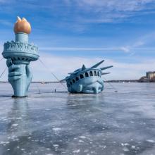 statue of liberty on lake mendota on sunny day