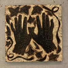 Woodcut featuring two hands.