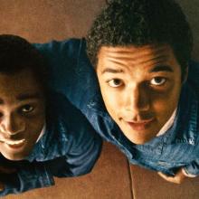 Still from film Nickel Boys, two young men look up at the ceiling