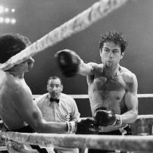 Still from film Raging Bull, men box in the ring.