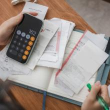 student budgeting with calculator