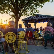 people sitting at the terrace at sunset