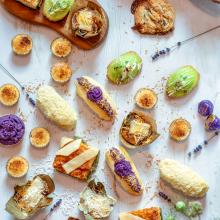Colorful desserts and snacks on a white tablecloth