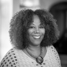 A headshot of Ruby Bridges smiling.