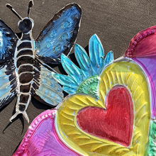 Photo of creafted coloful brilliant tin folk art. 