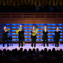 Photo of Canadian Brass performing on stage.