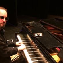 Dave Stoler playing the keyboard.