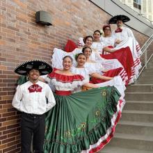 UW Grupo Folklorico group posing on stairs 