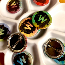 Photo of a collection of buttons with the letter "W". 