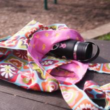 Image of a tote bog holding a waterbottle. 