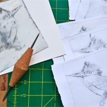 Photo of drypoint printing with images of birds.
