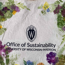 Photo of a tote bag stamped by dyed flowers. 