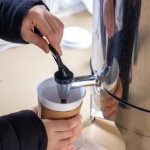 Hot Cocoa being poured into a cup