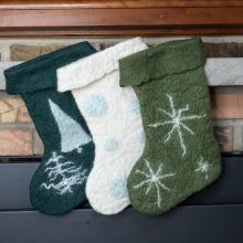 Photo of three felted stockings. 