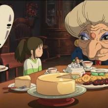 three animated characters seated at a table covered with food