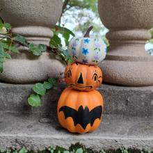 Photo of three painted pumpkins.