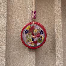 Photo of a pressed flower ornament.
