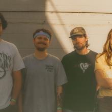 Liquid Mike band photo featuring all four members.