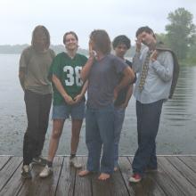 Members of Harlow standing on a dock